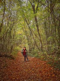 Woman in forest during autumn