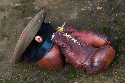 High angle view of boxing gloves and military hat