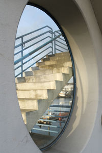 Reflection of spiral staircase in modern building