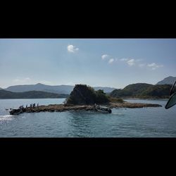 Scenic view of sea with mountains in background
