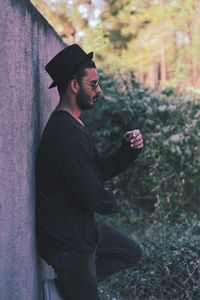 Side view of young man looking away