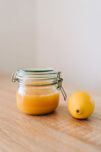 Close-up of fruits in glass jar on table