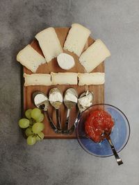 High angle view of fruits on cutting board on table