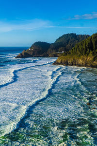 Scenic view of sea against blue sky