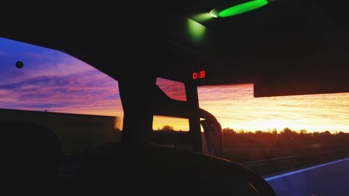 Close-up of silhouette car against sky during sunset