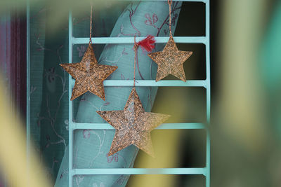 Close-up of christmas decoration hanging on tree at home