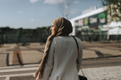 Rear view of woman looking away