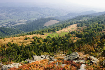 Scenic view of landscape and mountains against sky