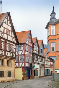 Street with historical half-timbered house in budingen, hesse, germany