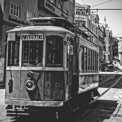 Train on railroad track in city