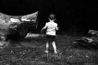 Boy standing on grass