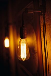 Close-up of illuminated light bulbs at home