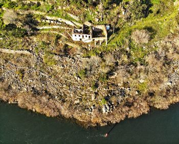 High angle view of rocks by lake