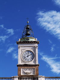 Low angle view of clock tower against sky