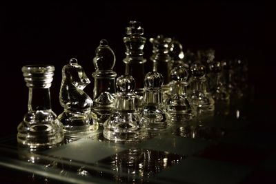 Close-up of chess pieces against black background