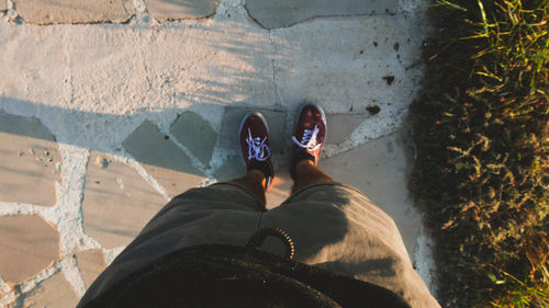 Low section of woman standing on ground