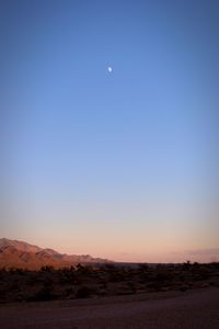 Scenic view of landscape against clear blue sky