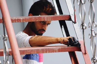 Worker painting steps