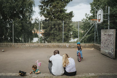 Family with daughters spending time actively outdoors