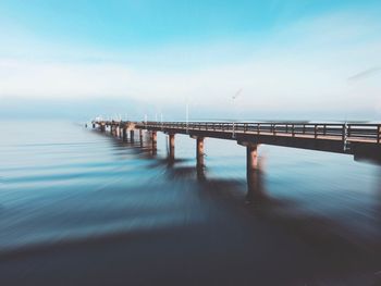 Pier over sea against sky