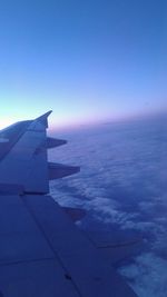 Cropped image of airplane over sea