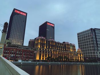 Modern buildings in city against sky