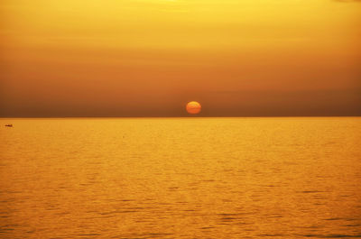 Scenic view of sea at sunset