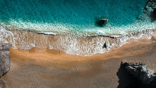 High angle view of rocks in sea