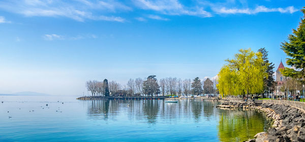 Scenic view of lake against blue sky