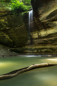 Scenic view of river flowing through rocks