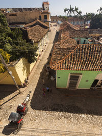 High angle view of buildings and trees in city
