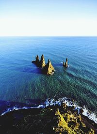 Scenic view of sea against blue sky