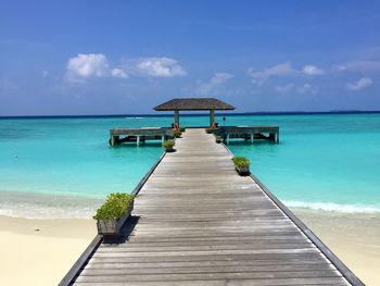 Pier over sea against sky