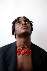 Black man wearing chili necklace portrait