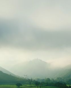 Scenic view of agricultural landscape against sky