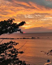 Scenic view of sea against orange sky