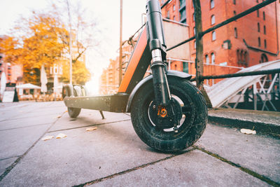 Close-up of bicycle on street in city during autumn