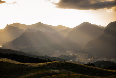 Scenic view of mountains against sky during sunset