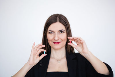 Portrait of a smiling young woman over white background