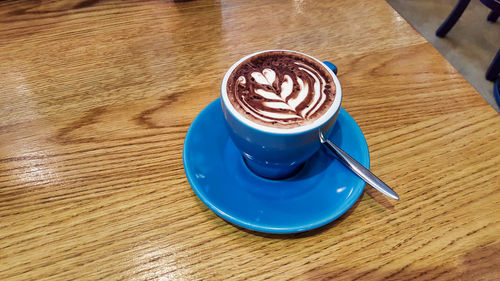 High angle view of cappuccino on table