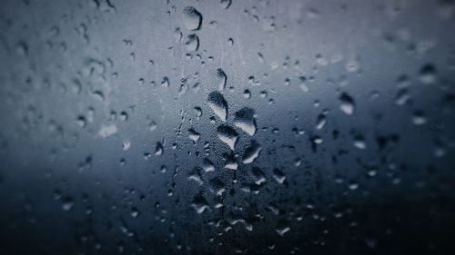 Full frame shot of wet window in rainy season