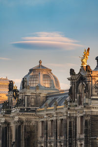 Statue of historic building against sky