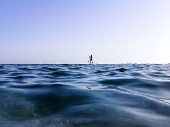 Scenic view of sea against clear sky