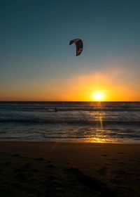 Scenic view of sea against sky at sunset