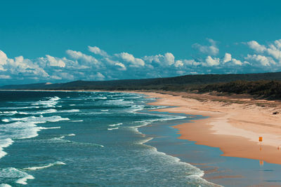 Scenic view of sea against blue sky