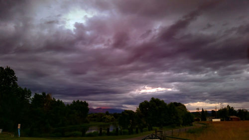 Scenic view of landscape against cloudy sky