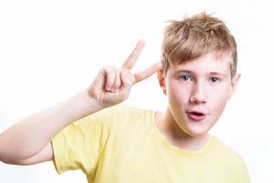 Portrait of boy against white background