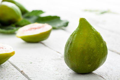 Close-up of green fruits on table