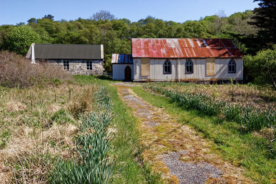 House on field against sky