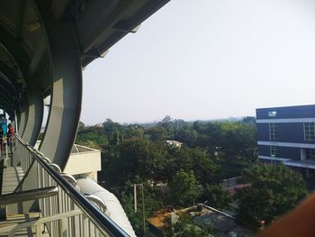 Bridge over city against clear sky